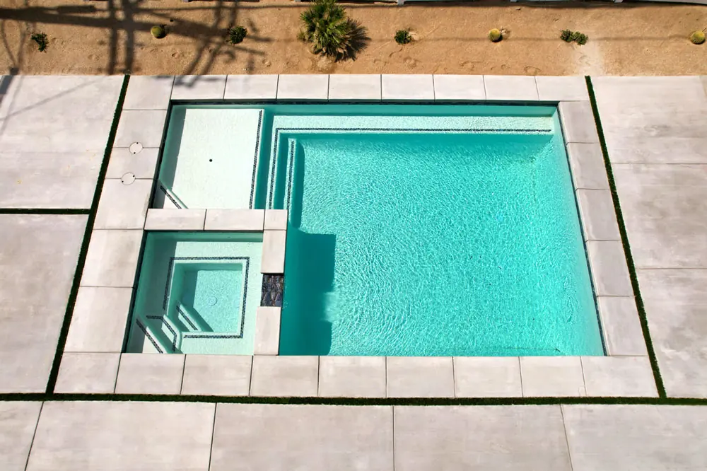 Aerial view of a 25 by 12 foot pool with a 6 by 6 foot spa