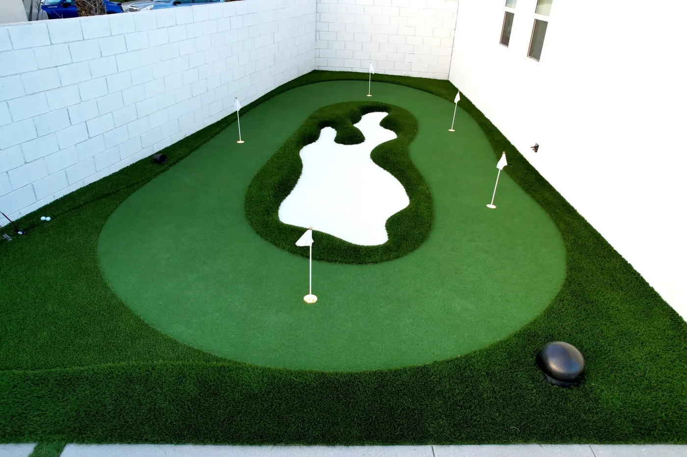 Backyard putting green with flags