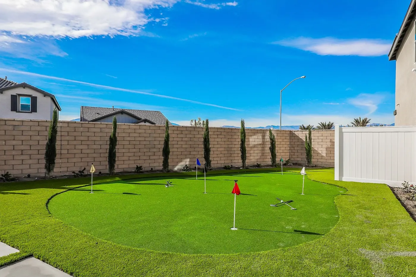 Synthetic putting green with a red flag